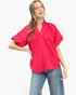 Beach Rose Co. hot pink blouse with smocked stand collar, scalloped V-neck, and lace-trimmed voluminous short sleeves.