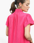 Beach Rose Co. hot pink shift dress with crinkled texture, ruffled stand collar, and gathered short sleeves.