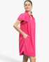 Beach Rose Co. hot pink textured shift dress with ruffled stand collar, split neckline, and side pockets on a model.