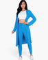 Beach Rose Co. model wearing a vibrant Ibiza blue ribbed long cardigan and matching leggings set over a white crop top.