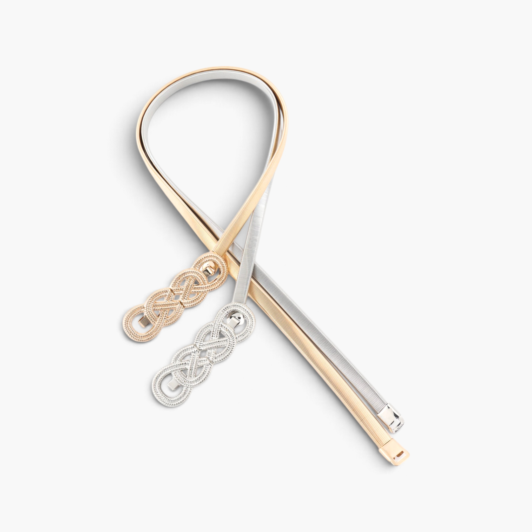 Beach Rose Co. slim metal waist belts with interwoven knot buckles in gold and silver tones on a white background.