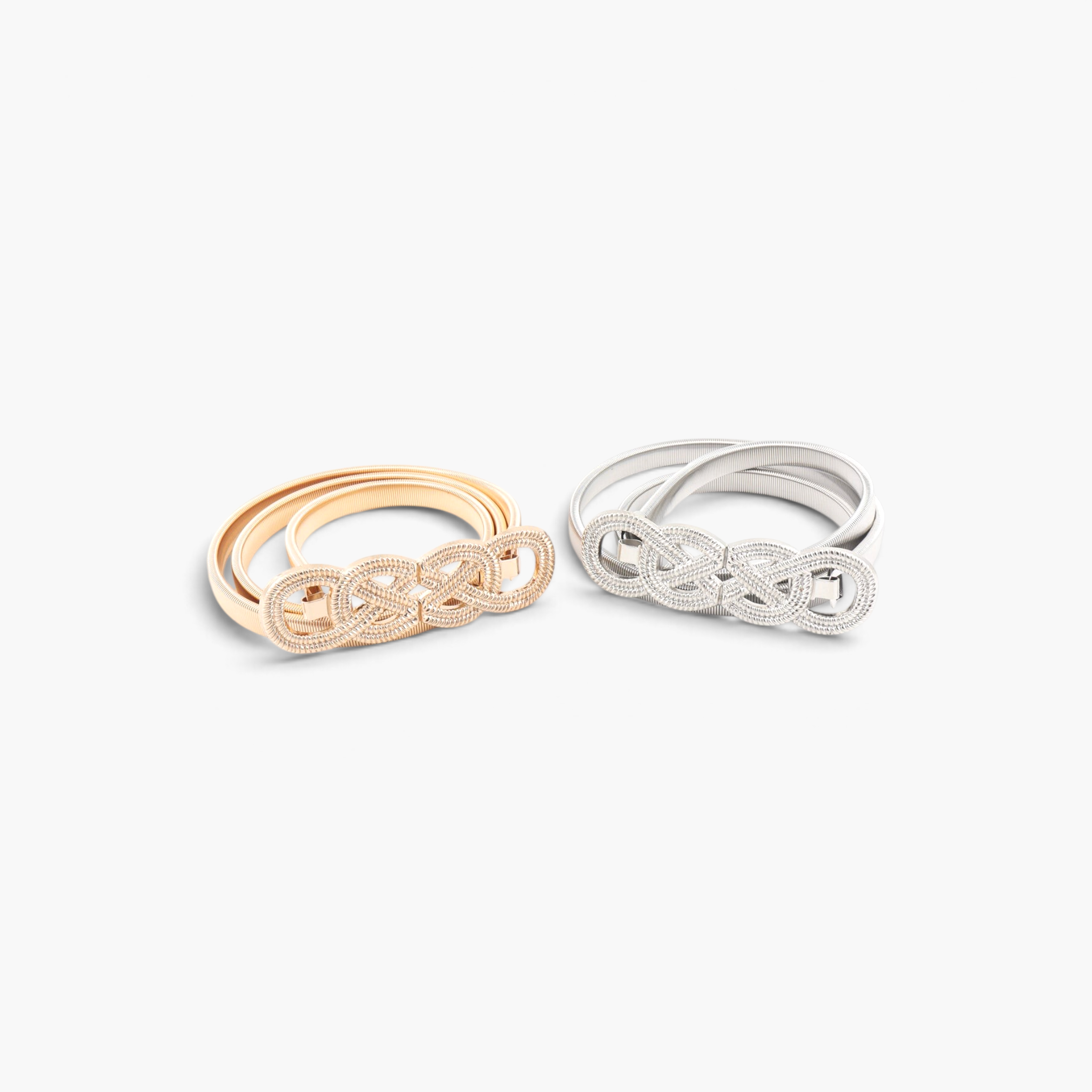 Beach Rose Co. gold and silver slim metal waist belts with intricate interwoven knot buckles and ridged bands.