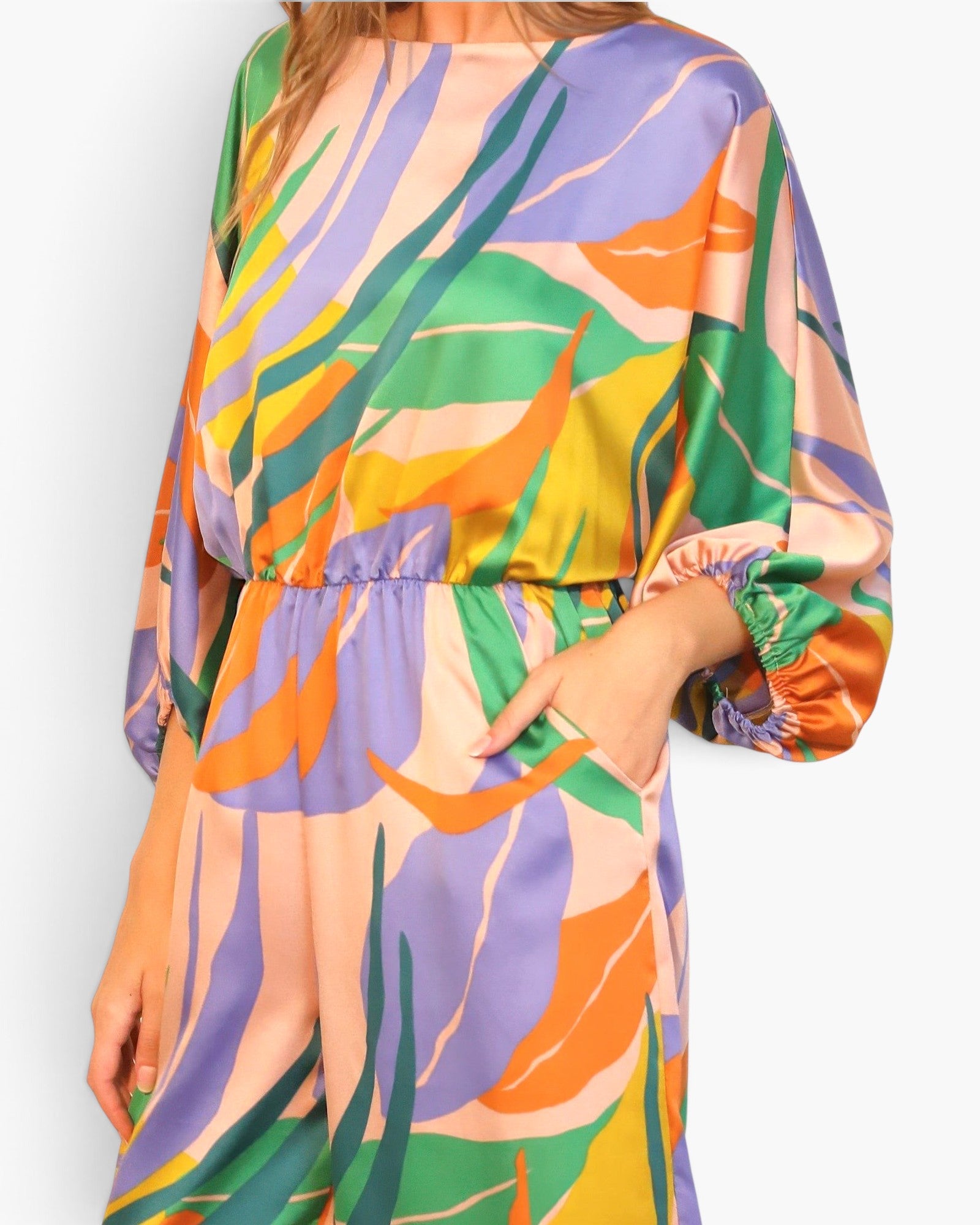 Beach Rose Co. Isla Tropical satin jumpsuit with a boat neck, blouson bodice, and vibrant multi-colored leaf print.