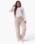 Beach Rose Co. ivory and beige ribbed two-piece set with long-sleeve pocket top and wide-leg drawstring pants.