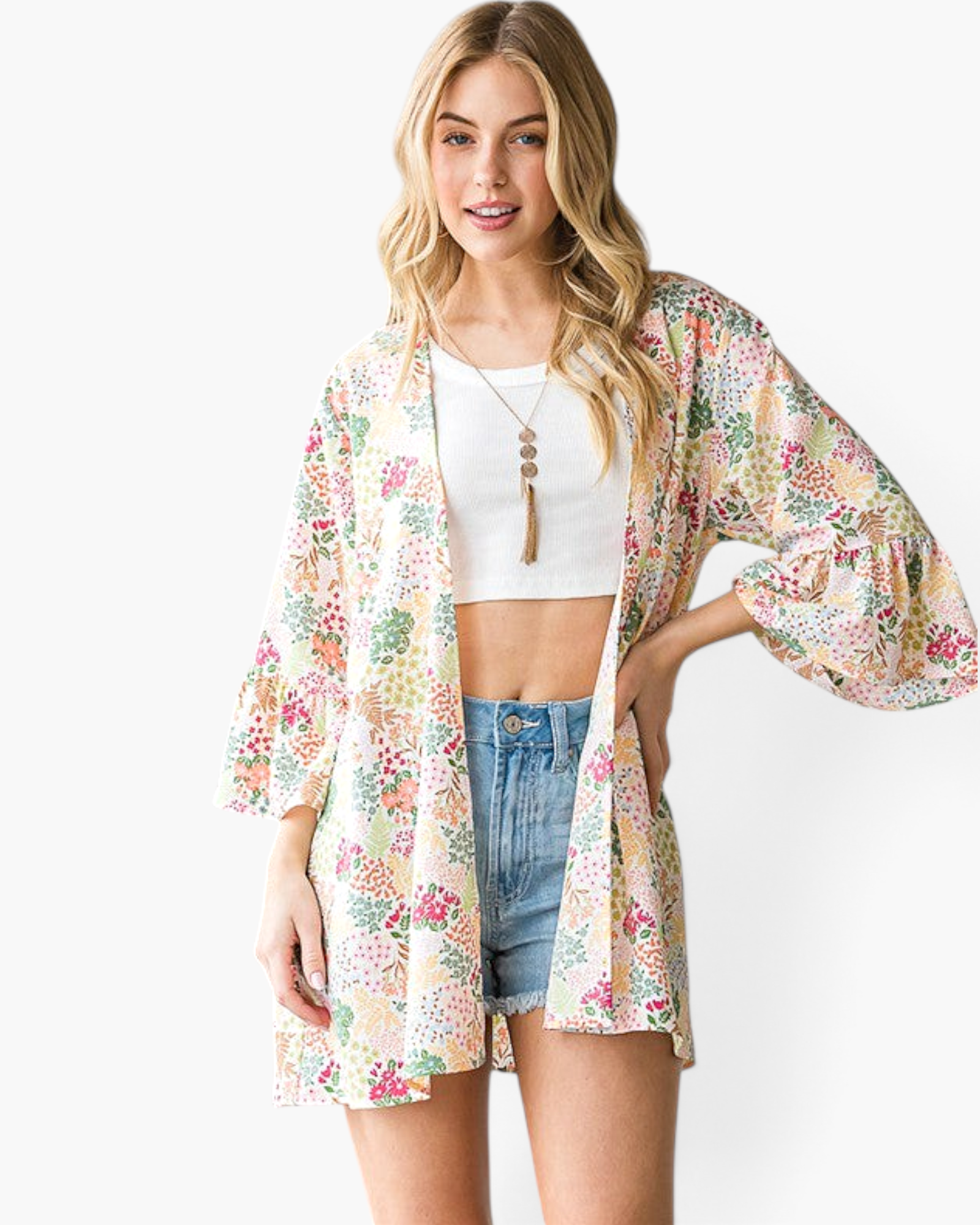 Beach Rose Co. ivory kimono with a multicolor botanical print, open front, and flowy three-quarter bell sleeves.