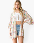 Beach Rose Co. ivory kimono with a multicolor botanical print, open front, and flowy three-quarter bell sleeves.