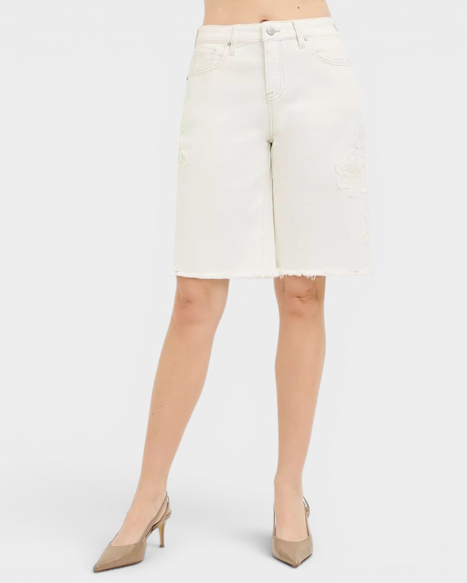 Beach Rose Co. ivory denim Bermuda shorts with tone-on-tone floral embroidery and raw hem. 98% cotton, 2% spandex.