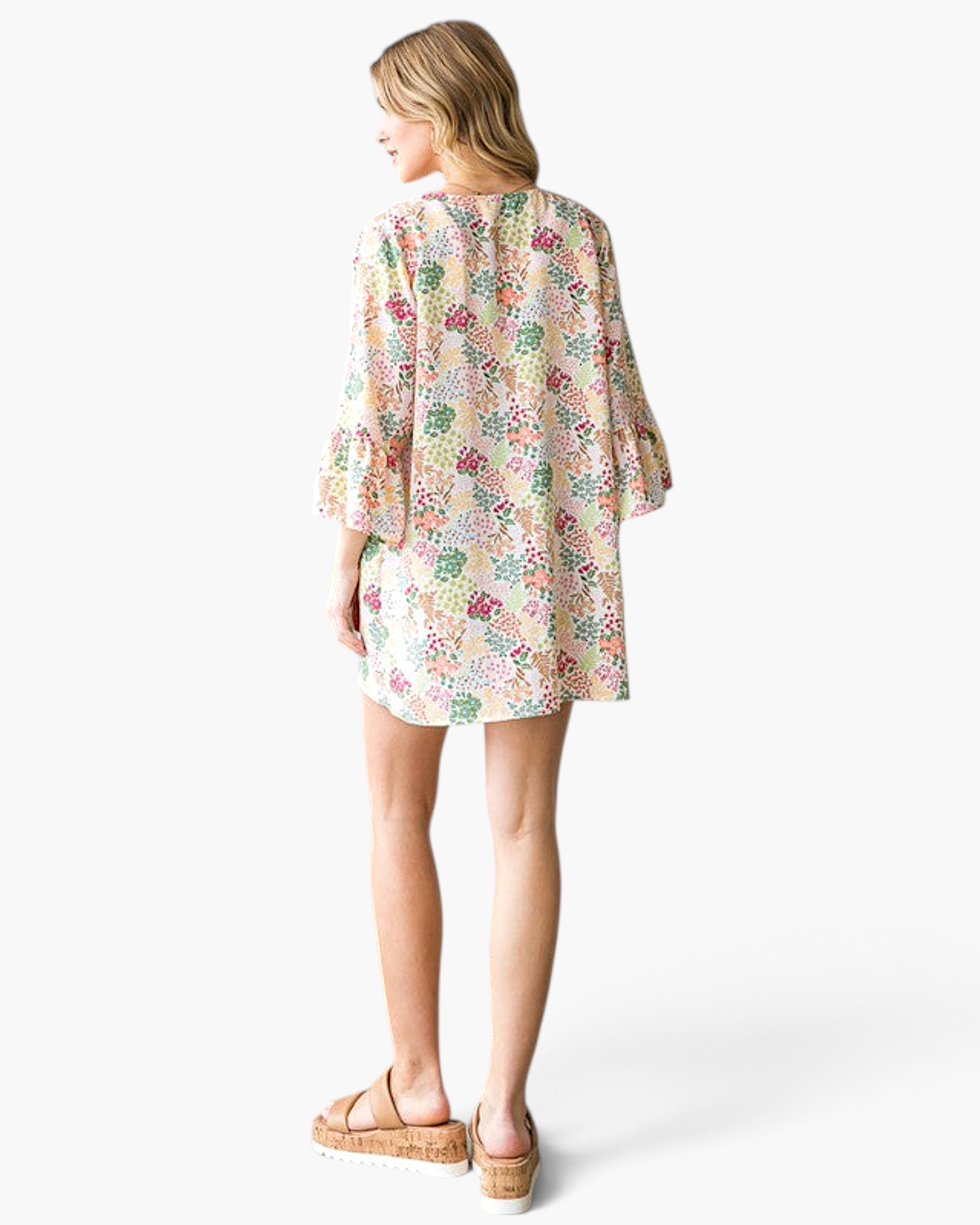 Beach Rose Co. ivory floral kimono with bell sleeves and a botanical print worn by a model from the back view.