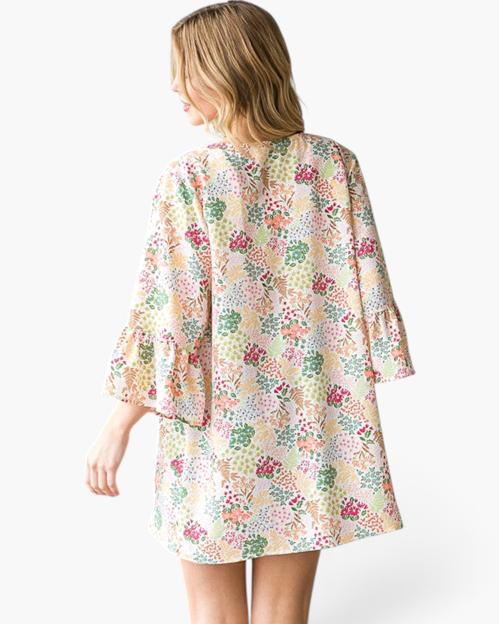 Beach Rose Co. ivory kimono with a colorful botanical print, bell sleeves, and a relaxed fit, shown from the back.