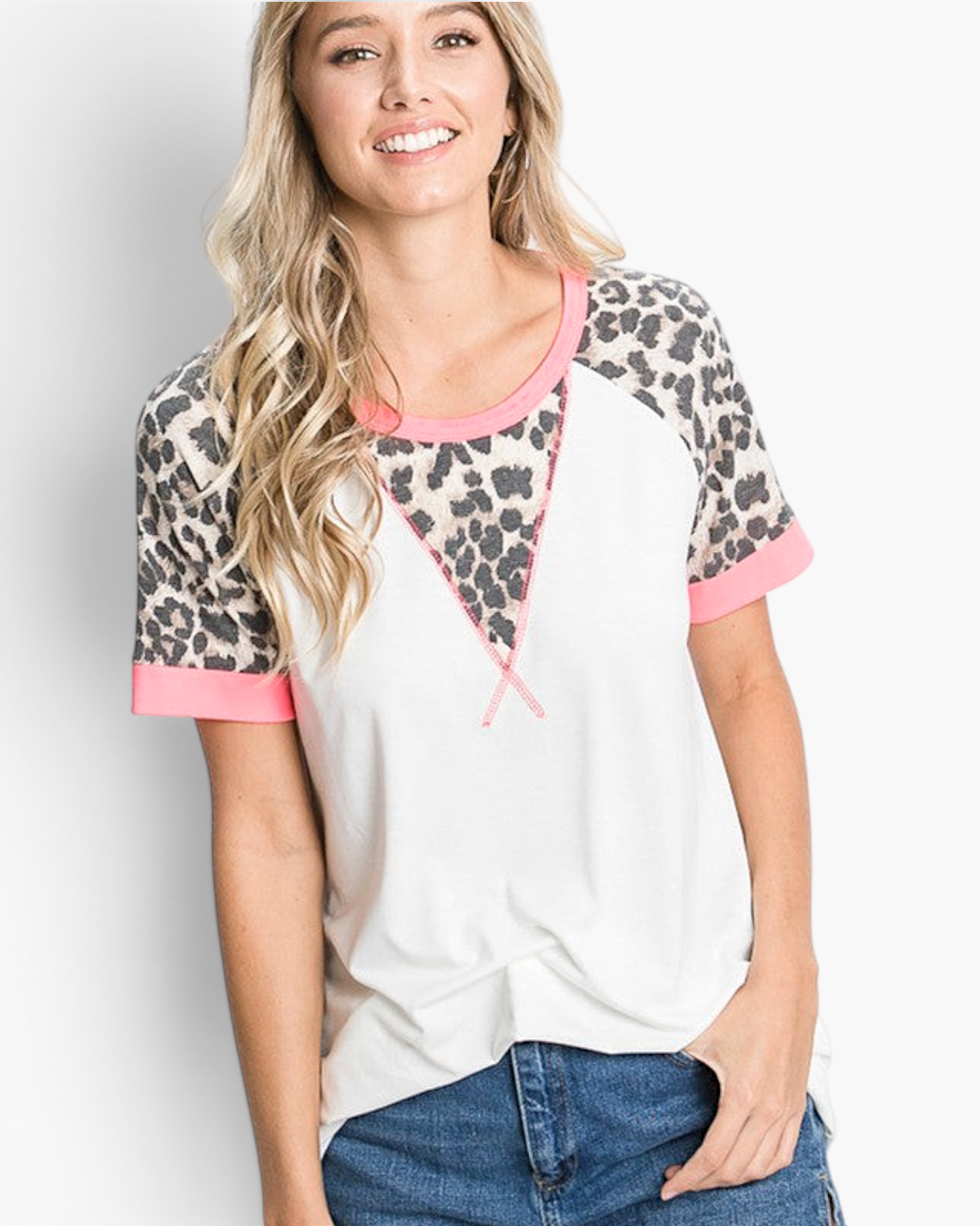 Beach Rose Co. ivory top with leopard print raglan sleeves, pink trim, and a relaxed fit worn by a smiling woman.