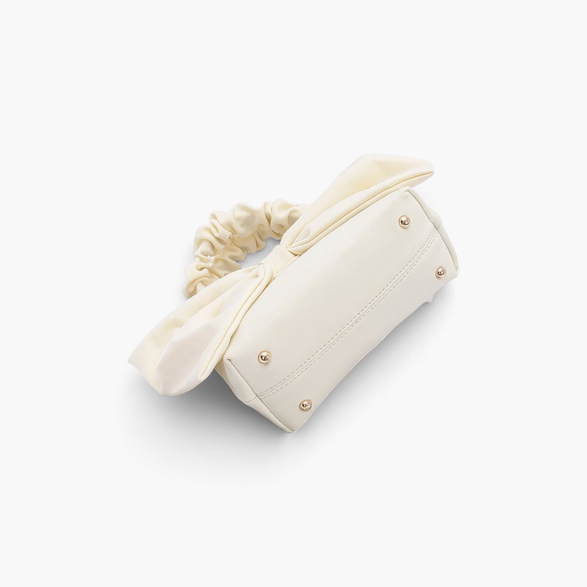 Beach Rose Co. ivory nylon clutch with a decorative front bow and a ruched top handle against a white background.