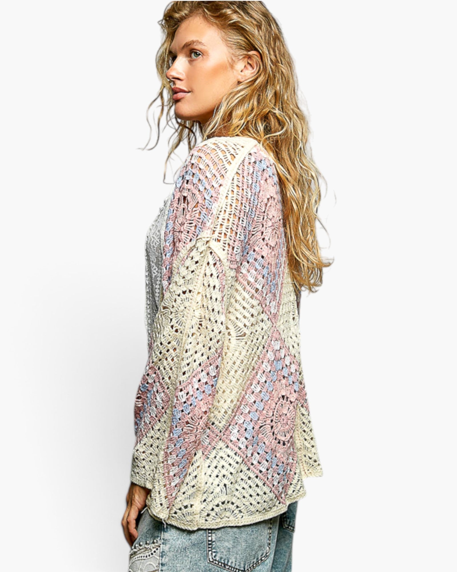 Model wearing a Beach Rose Co. ivory and pink crochet medallion cardigan with wide sleeves and open-front design.