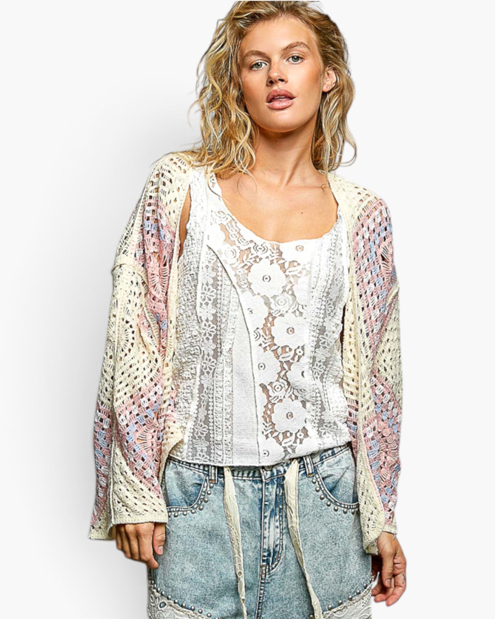 Beach Rose Co. ivory and pink crochet medallion open-front cardigan with wide sleeves worn by a blonde model.