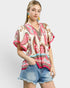 Beach Rose Co. ivory rayon top with pink paisley border print, split neckline, tie detail, and wide short sleeves.