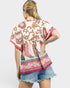 Beach Rose Co. Ivory and pink paisley border print rayon top with split neckline and wide short sleeves.
