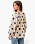 Beach Rose Co. ivory cotton top with black polka dots, long balloon sleeves, and a gathered back view on a model.
