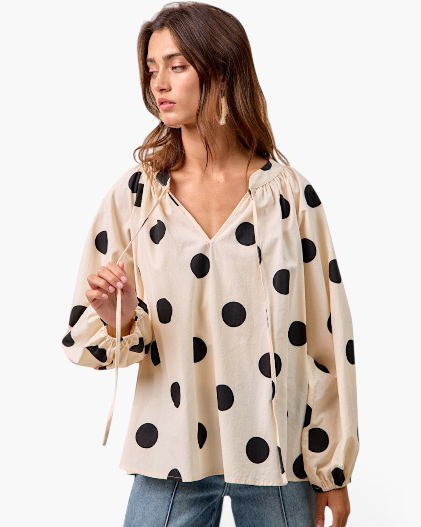 Beach Rose Co. ivory cotton top with black polka dots, featuring a split neckline with ties and long balloon sleeves.