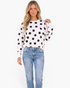 Beach Rose Co. ivory sweatshirt with oversized black polka dots, crew neck, and dropped shoulders worn with jeans.