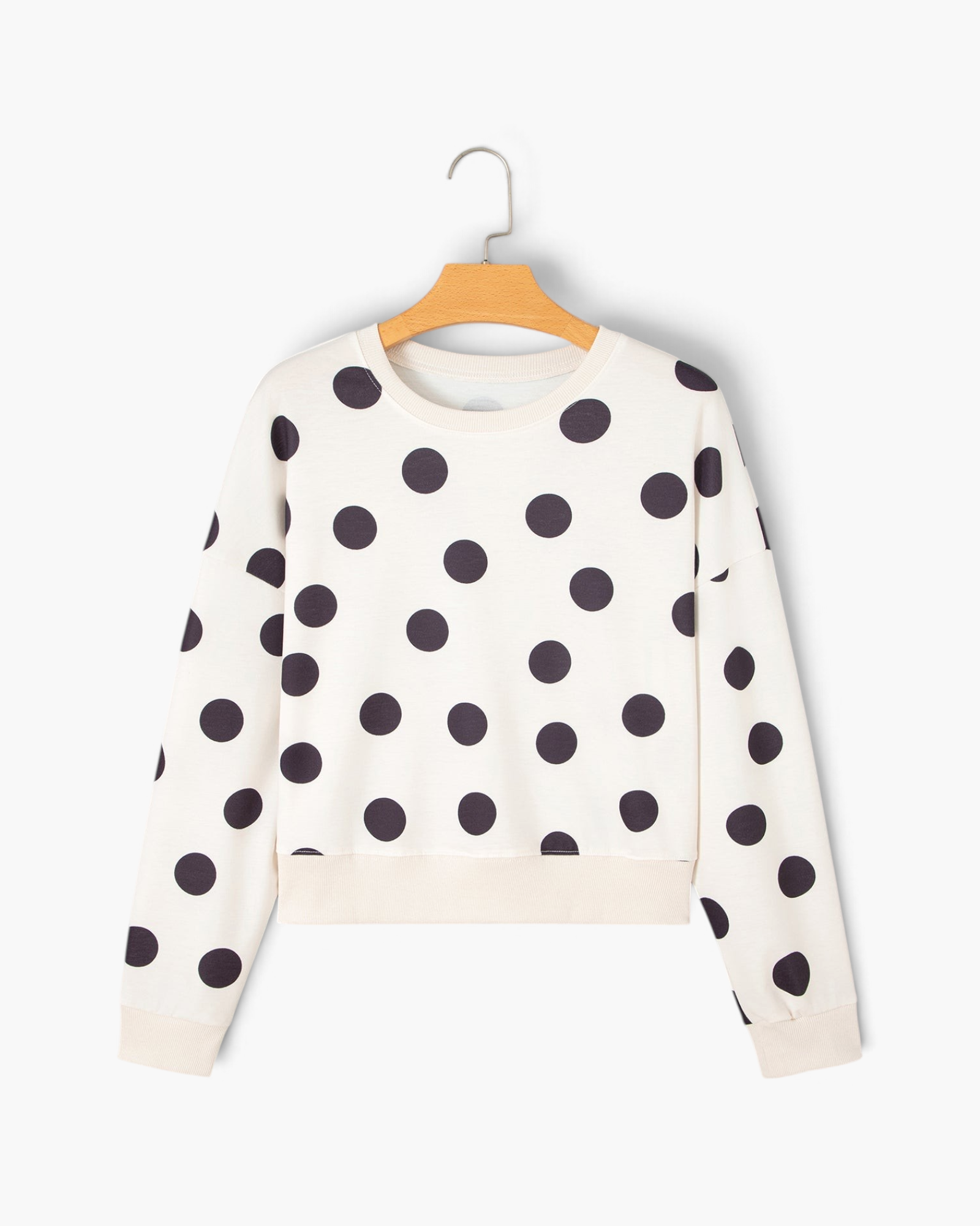 Beach Rose Co. ivory sweatshirt featuring an oversized black polka dot pattern, crew neckline, and dropped shoulders.