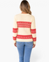 Beach Rose Co. ivory cable knit sweater with red Fair Isle patterns on the back and sleeves, worn with blue jeans.