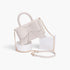 Beach Rose Co. ivory faux leather handbag with a ribbon bow detail, top handle, and gold chain shoulder strap.