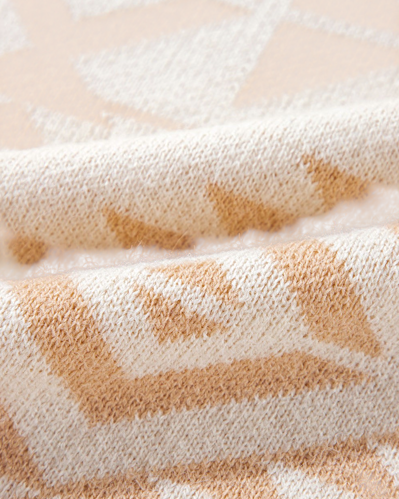 Beach Rose Co. ivory sweater fabric with a soft blush and beige Southwestern geometric knit pattern close-up