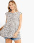 Beach Rose Co. ivory tiered flutter sleeve top with black spotted print and round neckline worn with denim shorts