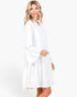 Beach Rose Co. ivory tiered shift dress with long bell sleeves and a split neckline worn by a blonde model