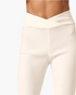 Beach Rose Co. ivory high-rise flare pants with a flattering crossover V-waistband in soft stretch fabric.