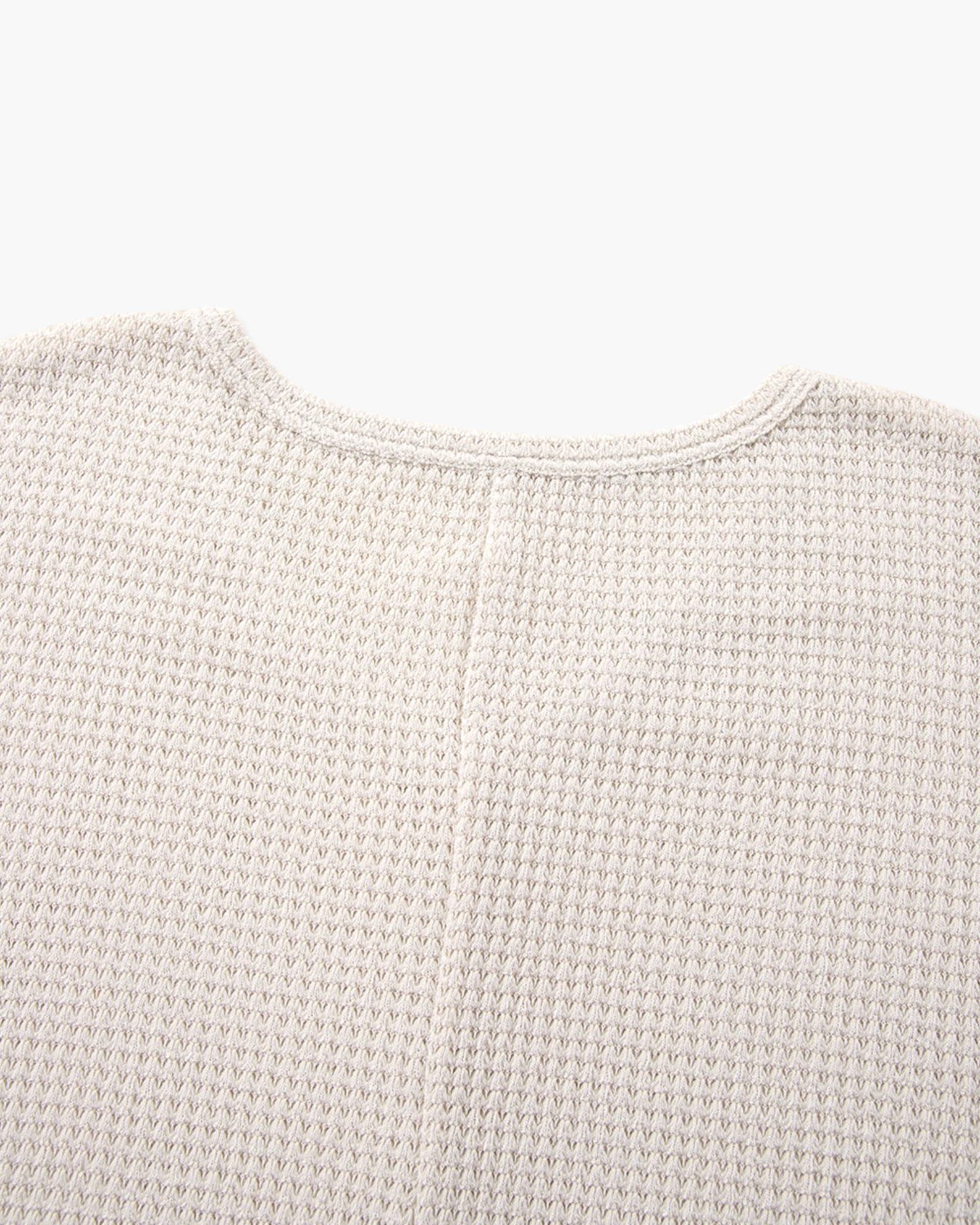 Beach Rose Co. ivory waffle-knit tunic top featuring a textured fabric and a comfortable V-neckline.