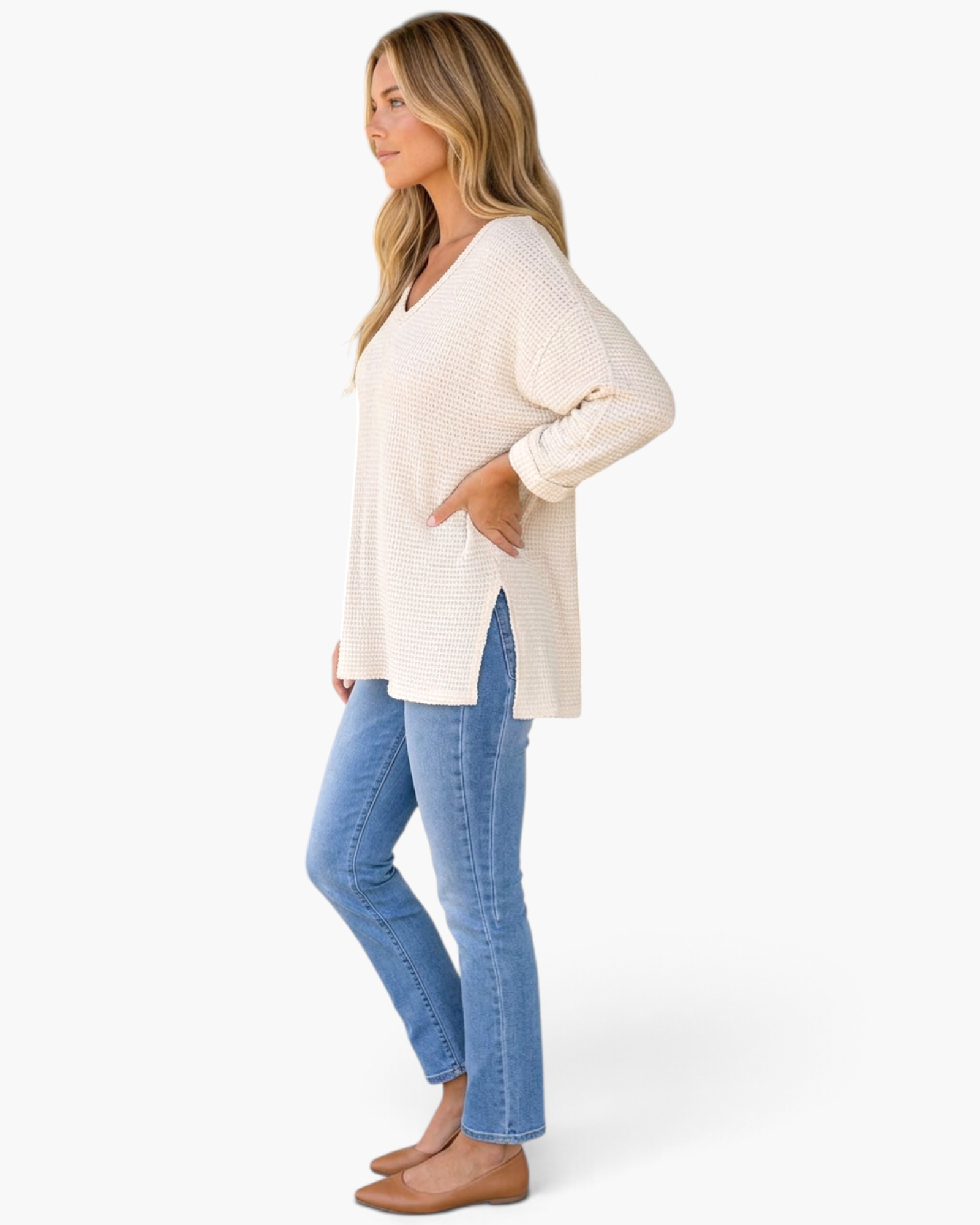 Beach Rose Co. ivory waffle-knit V-neck tunic top with three-quarter sleeves and side slits worn with blue jeans