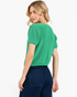 Beach Rose Co. jade green textured knit sweater with short puff sleeves and V-neckline worn by a model