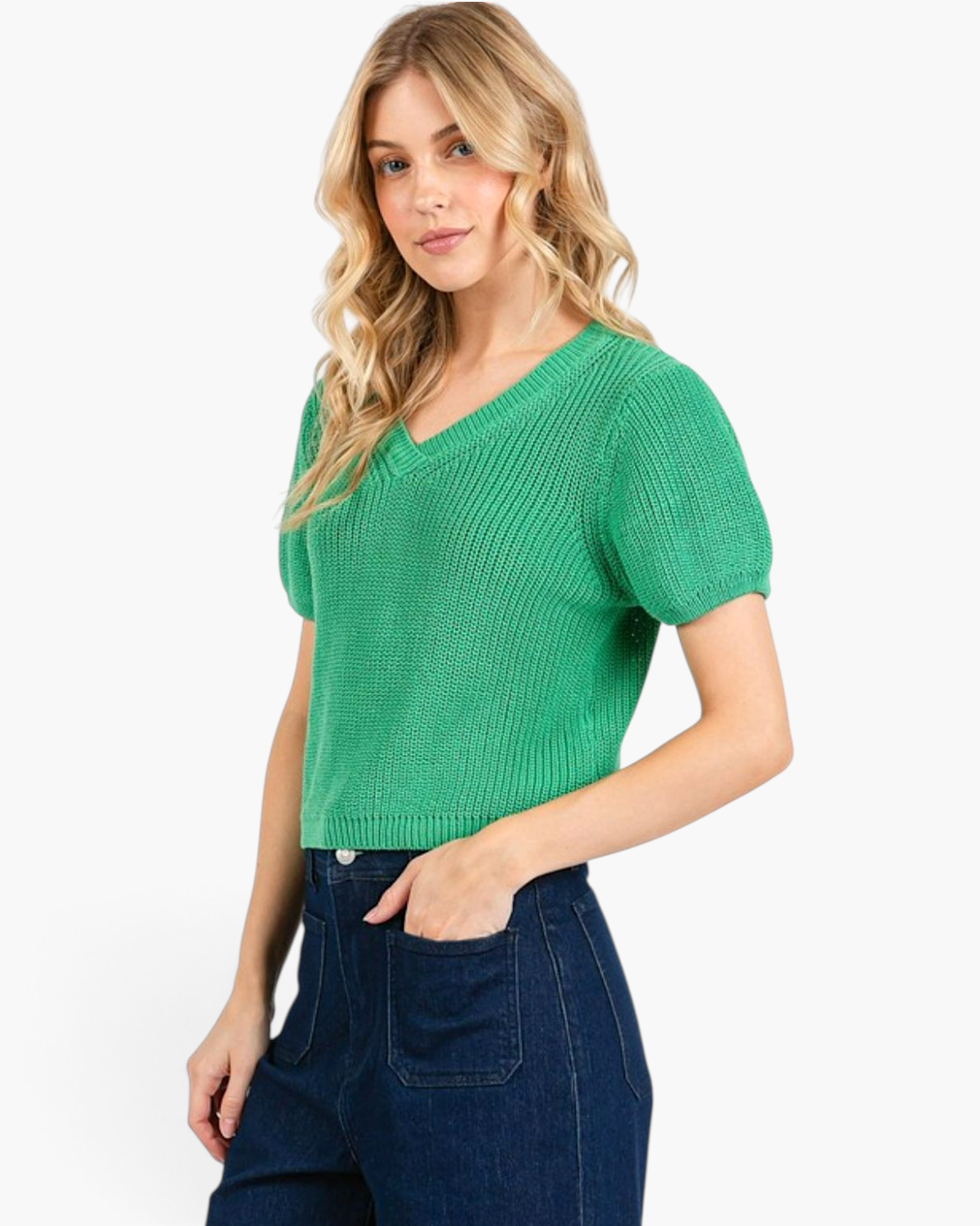 Beach Rose Co. jade green textured knit sweater with a V-neck and short puff sleeves worn with dark denim jeans.
