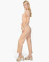 Beach Rose Co. model wearing a khaki tie waist relaxed jumpsuit in soft rib knit fabric, side profile view.
