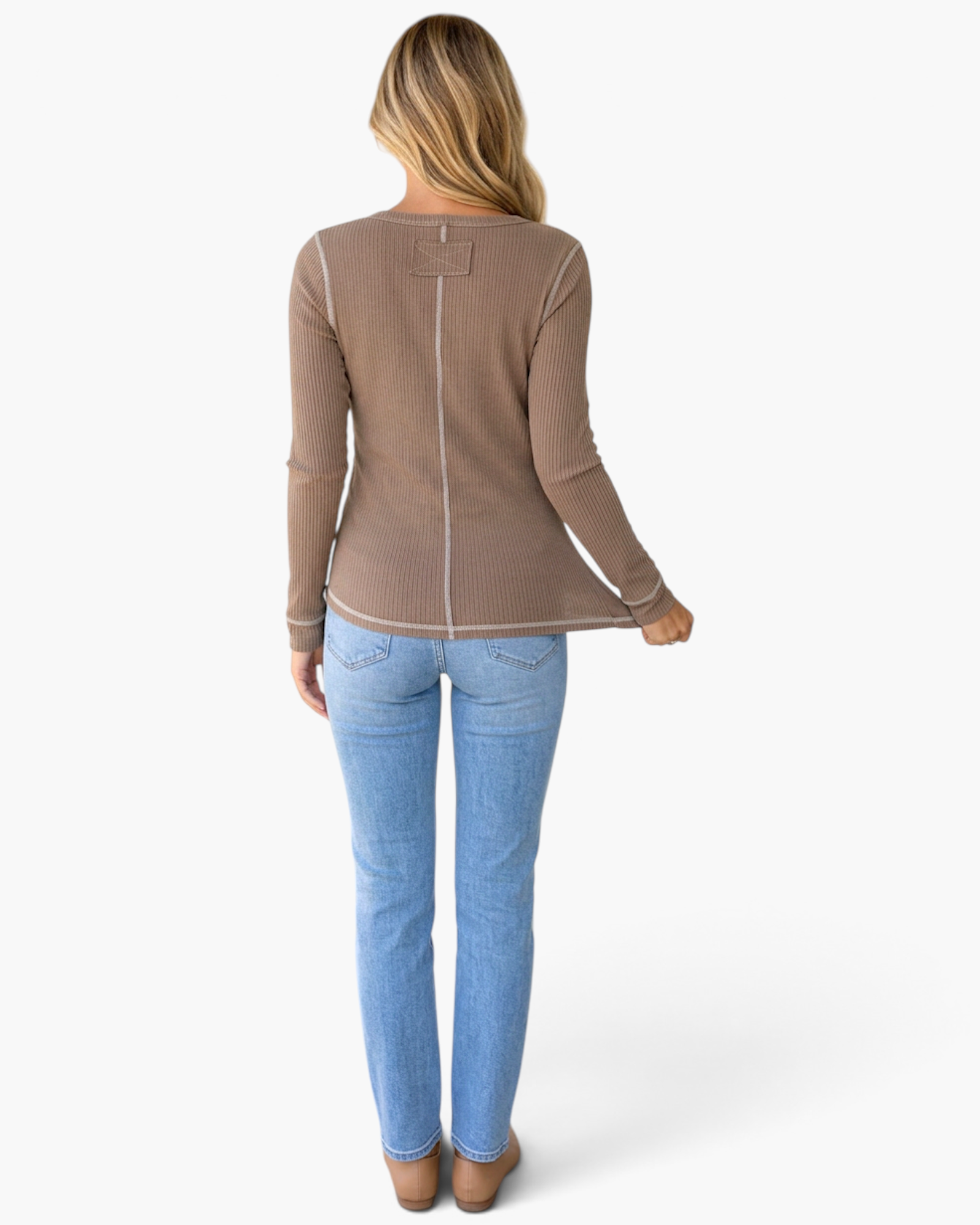 Back view of a Beach Rose Co. dark khaki ribbed long-sleeve top with contrast stitching, worn with light blue jeans.