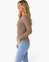 Beach Rose Co. dark khaki ribbed Henley top with contrast stitching and long sleeves worn by a blonde model