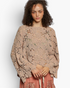 Beach Rose Co. latte open-knit crochet long sleeve top with scalloped edges worn by a model with curly hair.