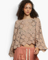 Beach Rose Co. latte open-knit crochet long sleeve top with scalloped edges worn by a model.