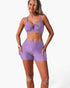 Beach Rose Co. lavender two-piece bikini with a crisscross top and tummy control shorts featuring side pockets.