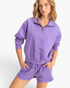 Beach Rose Co. lavender cotton half-zip pullover with stand collar and dropped shoulders worn by a blonde model