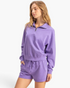 Beach Rose Co. lavender cotton half-zip pullover with a stand collar and dropped shoulders worn by a blonde model.