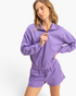 Beach Rose Co. lavender cotton half-zip pullover with stand collar and dropped shoulders worn by a model.
