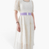 Beach Rose Co. wide lavender elastic waist belt with a rectangular alloy clasp worn over a floral midi dress