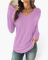 Beach Rose Co. lavender ribbed long sleeve knit top with a wide V-neckline and curved hem worn with blue jeans.