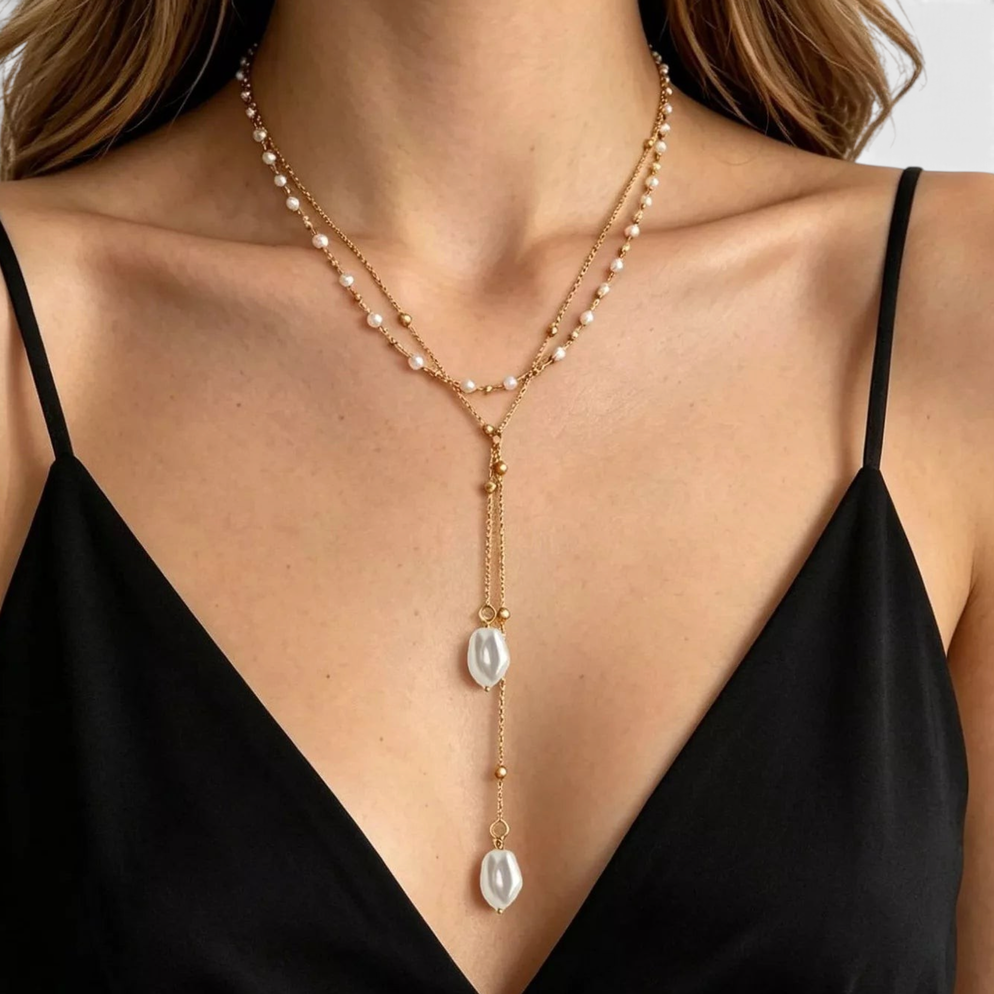 Beach Rose Co. 18K gold-plated layered Y-necklace with white faux pearl drops and gold bead accents on a model