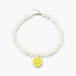 Beach Rose Co. white resin beaded necklace featuring a cheerful yellow lemon slice pendant on a short chain.