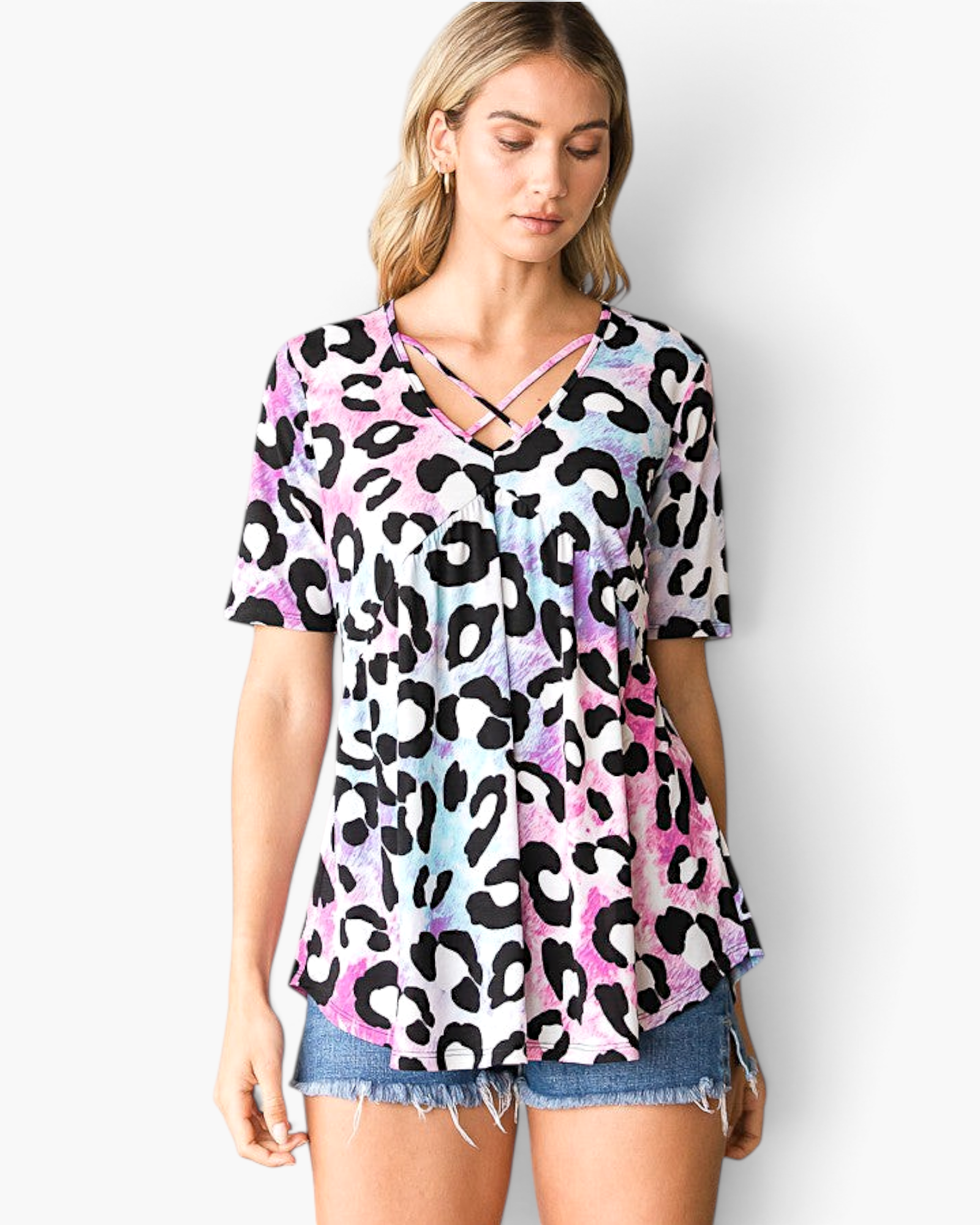 Beach Rose Co. multicolor leopard print babydoll top with a crisscross V-neckline and short sleeves on a model