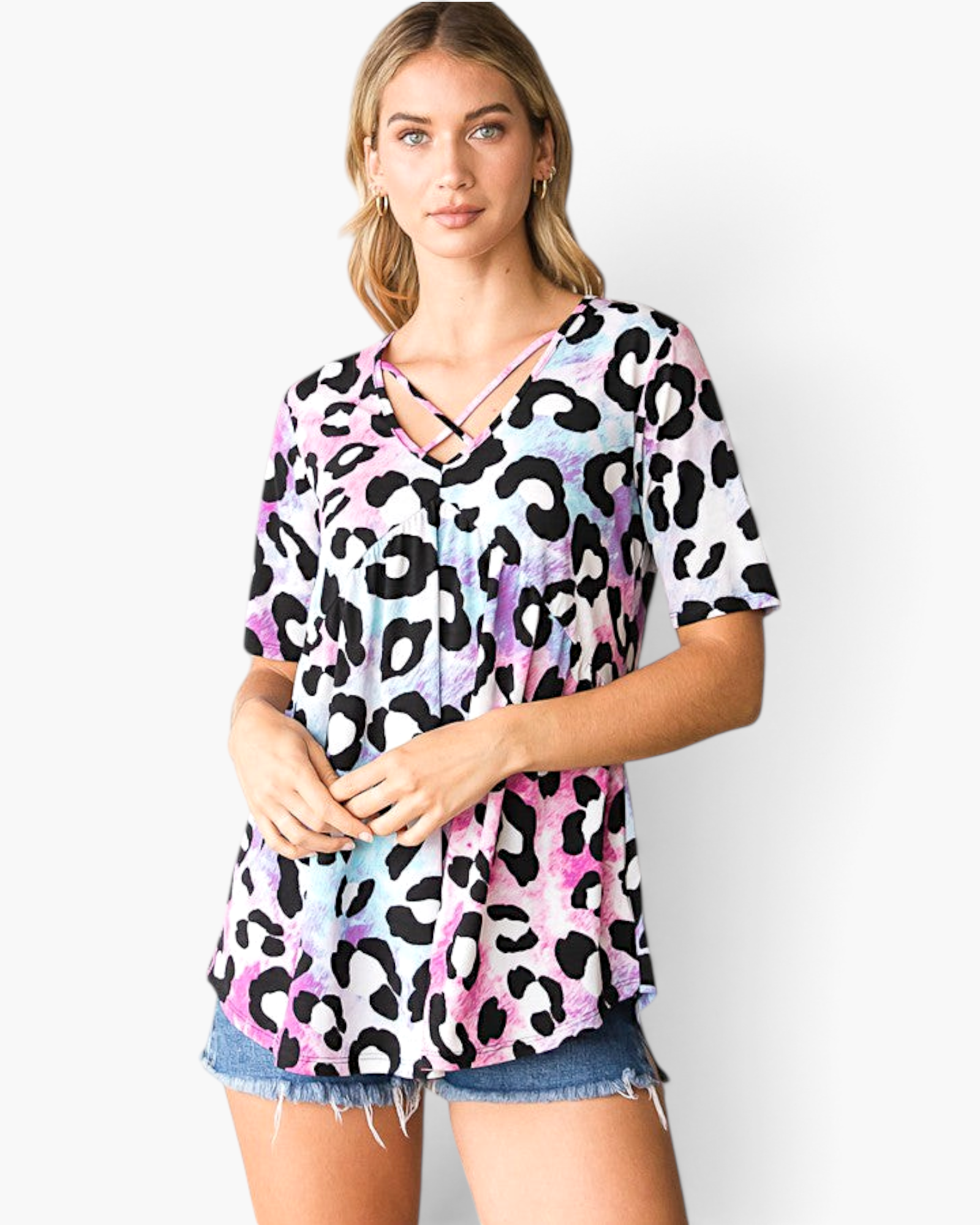 Beach Rose Co. multicolor leopard print babydoll top with a crisscross V-neckline and short sleeves on a model.