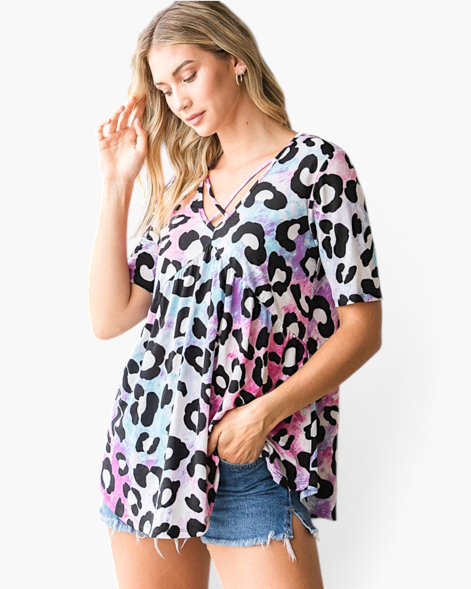 Beach Rose Co. multicolor leopard print babydoll top with a crisscross V-neckline and short sleeves on a model.