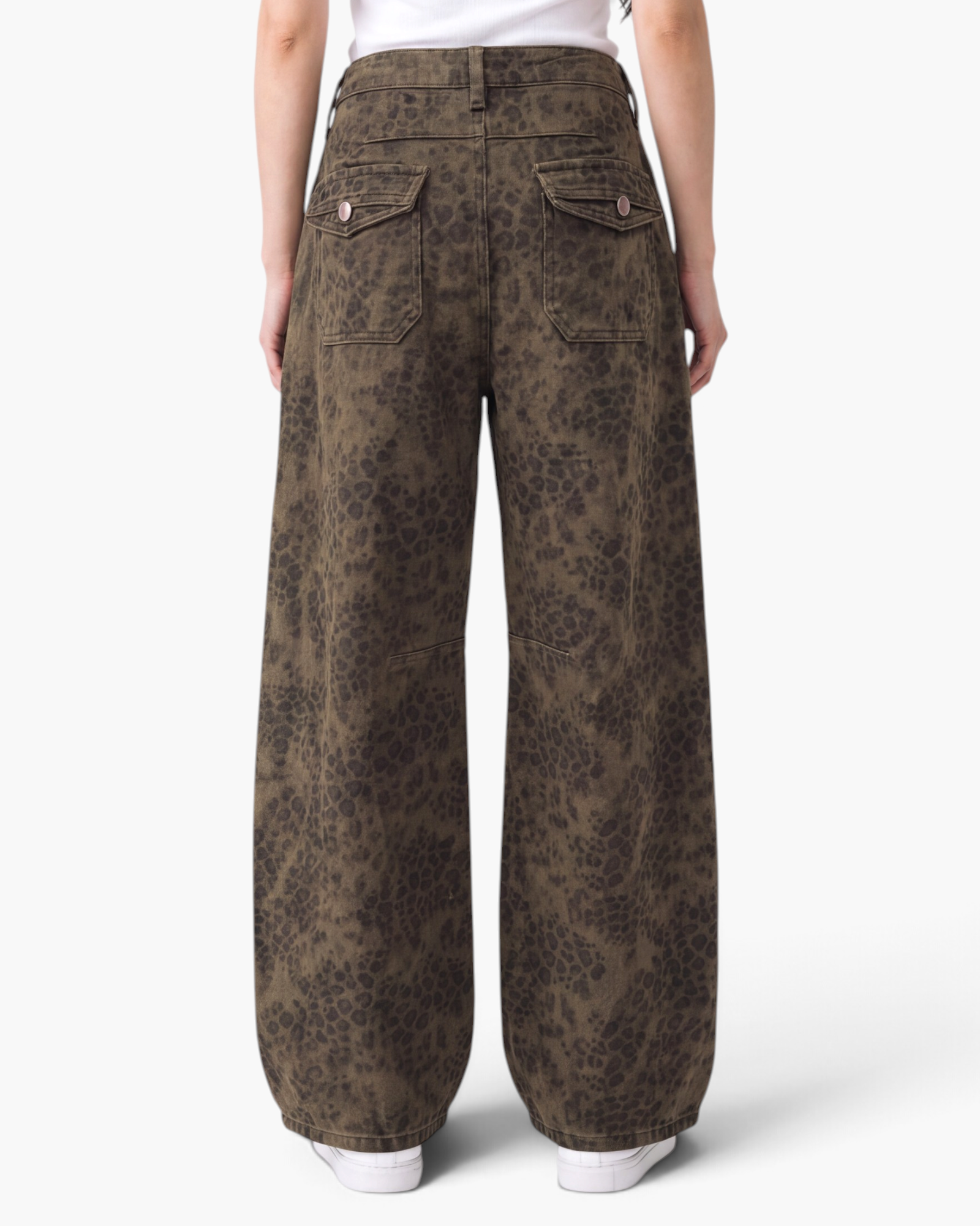 Beach Rose Co. brown leopard print barrel-leg jeans with buttoned back flap pockets and seamed knee detailing.